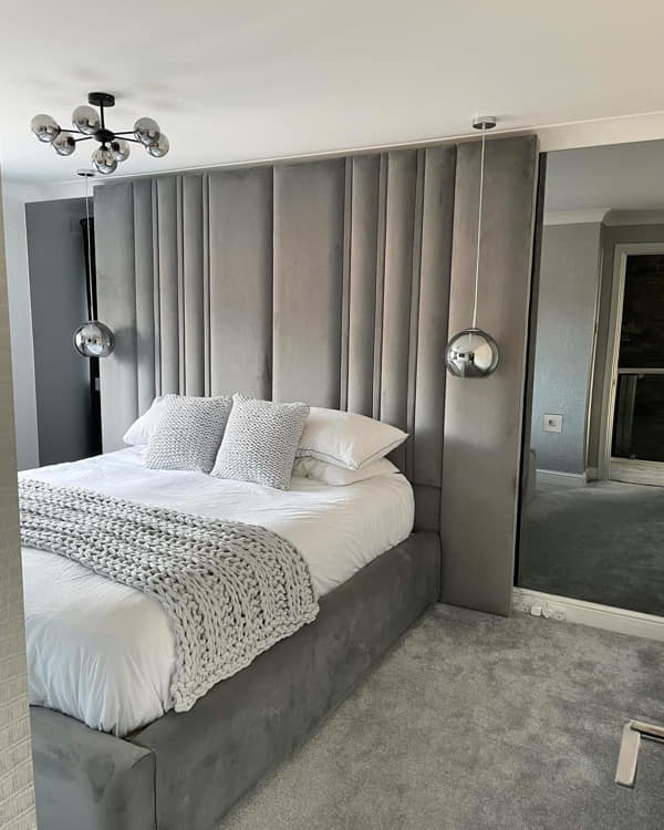 Floor to Ceiling Headboard with Mirrored Surfaces on Both Sides